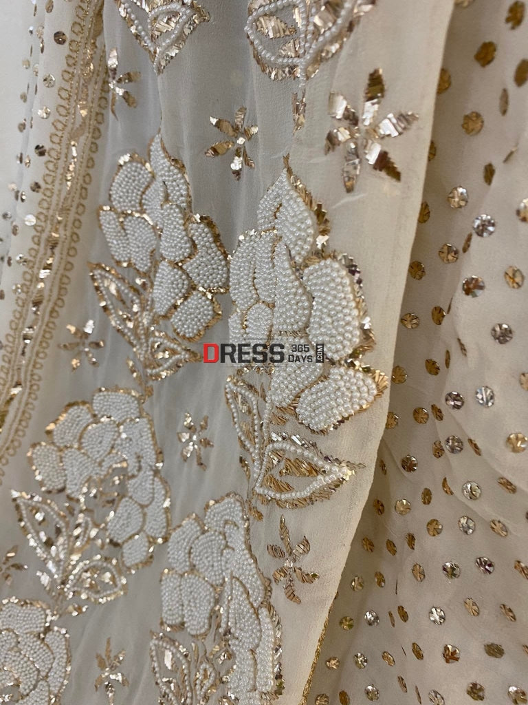 pearl work dress design Luxurious lilac evening gown with pearl embroidery on the shoulders