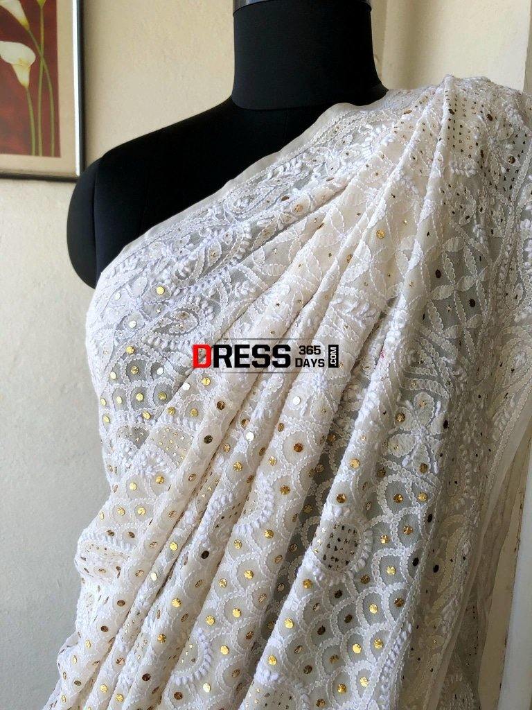 AK006 -Silk organza saree with all over jaal embroidery. Comes with stitched blouse size 38, can be altered to size 42