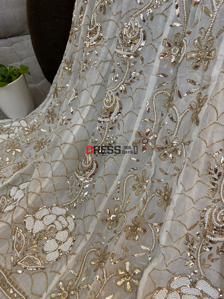 Ivory Heavy Pearl & Mukaish Anarkali Suit Chikankari