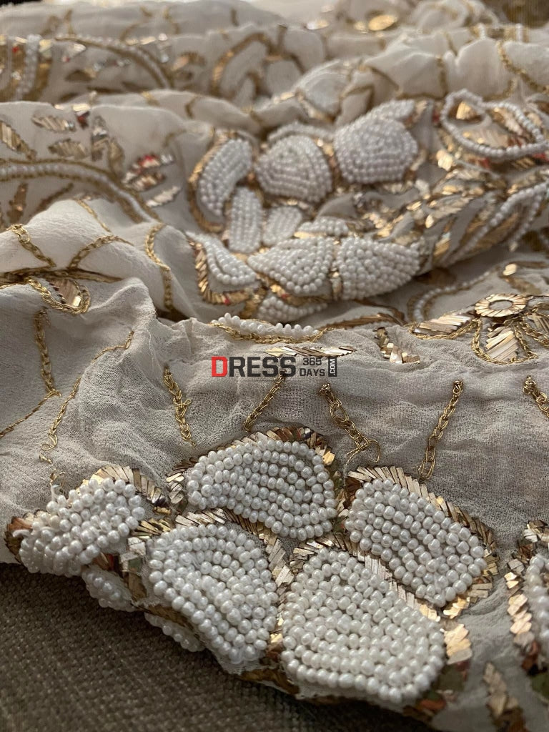 Ivory Heavy Pearl & Mukaish Anarkali Suit Chikankari