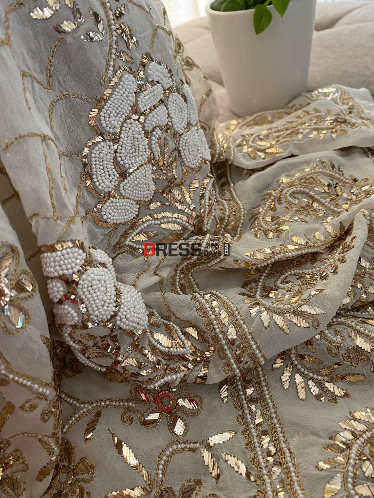 Ivory Heavy Pearl & Mukaish Anarkali Suit Chikankari