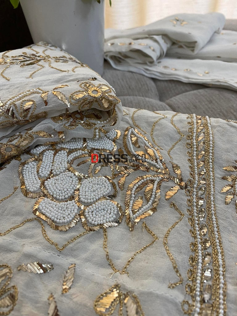 Ivory Heavy Pearl & Mukaish Anarkali Suit Chikankari