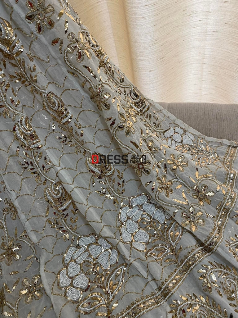 Ivory Heavy Pearl & Mukaish Anarkali Suit Chikankari